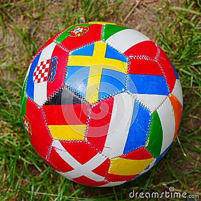 Red ball with various international flags on it with an interesting design Stock Photo