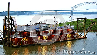 A Red Barge patrols the Mississippi river near downtown Memphis. Editorial Stock Photo