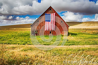 Red Barn with American flag Stock Photo