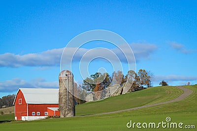 Red Barn with Silo in Wisconsin Countryside Stock Photo