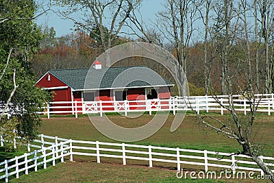 Red Barn and white fence Stock Photo