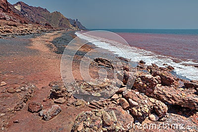 Red beach on iranian island of Hormuz, Hormozgan, Southern Iran. Stock Photo