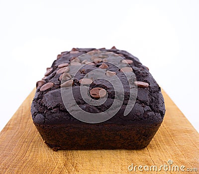 Red bean brownie loaf with chocolate chips on wooden cutting board Stock Photo