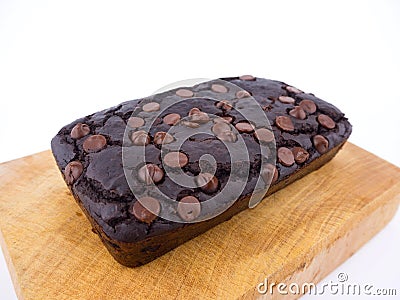 Red bean brownie loaf with chocolate chips on wooden cutting board Stock Photo