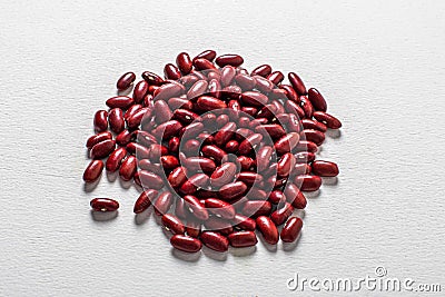 Red beans beautifully laid out on a white background. Vegetarian food Stock Photo