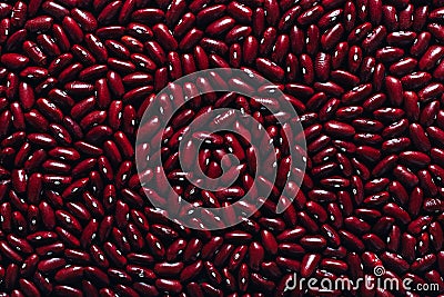 Red beans beautifully laid out on a wooden background. Top view. rectangular copy space. Vegetarian food. Unprepared Stock Photo