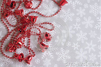 Red bells on the snowflake background. Space for. text Stock Photo