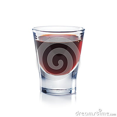 Red berries liqueur is the shot glass isolated on white. Stock Photo