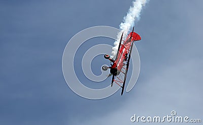 Red Biplane aerobatics at EAA AirVenture Airshow Editorial Stock Photo