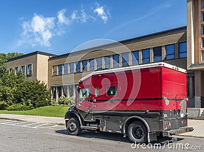 Red and black armored truck Stock Photo