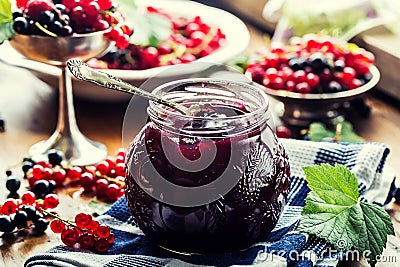 Red and black currants. red currant jam with fresh berry