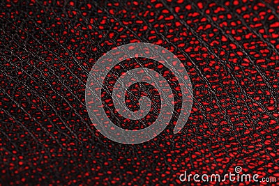 Red - black textured reptile skin, used texture for the background. Lizard or crocodile skin Stock Photo