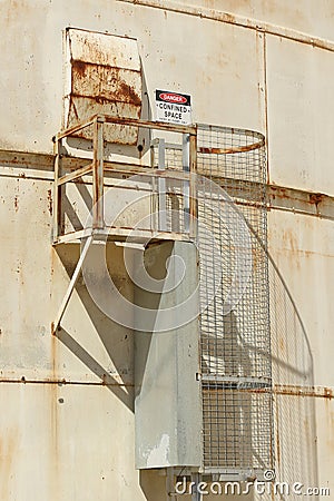 Red, black and white Danger, Confined Space warning sign on the exterior of a silo Stock Photo