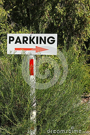 Red, black and white Parking sign with arrow Stock Photo