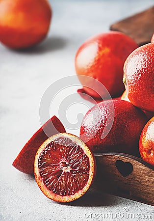 Red bloody oranges for making freshly squeezed juice, gray table background, selective focus, place for text Stock Photo