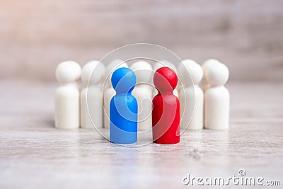 Red and blue businessmen with crowd of wooden men. Candidate, leadership, business, team, teamwork and Human resource management Stock Photo