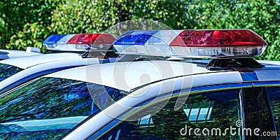 Red and blue flashes on the cars of the Patrol specialized unity. Police lights on car during traffic surveillance. Stock Photo