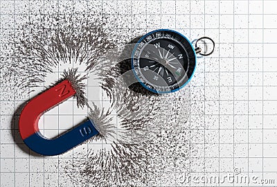 Red and blue horseshoe magnet or physics magnetic and compass with iron powder magnetic field on white paper graph background. Stock Photo