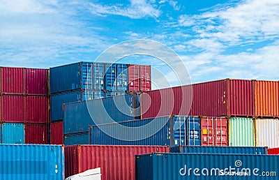 Red and blue logistic container against blue sky. Cargo and shipping business. Container ship for import and export logistics. Stock Photo