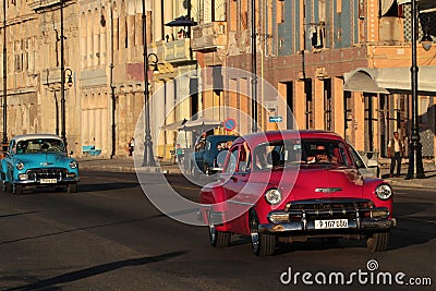 Red and blue old American cars in sunset Editorial Stock Photo