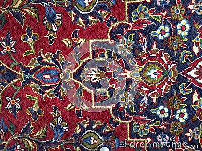 Red blue Persian rug on the floor with various shapes Stock Photo