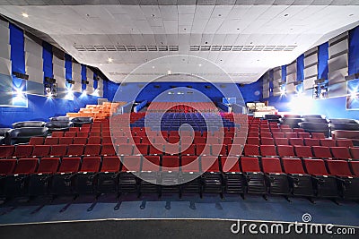 Red, blue seats and sofas in Neva cinema Editorial Stock Photo