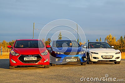 Red, blue and white cars Editorial Stock Photo