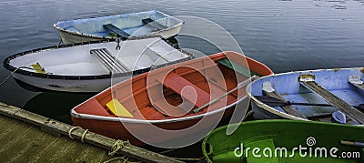 Colorful rustic weathered boats moored at the harbor Stock Photo