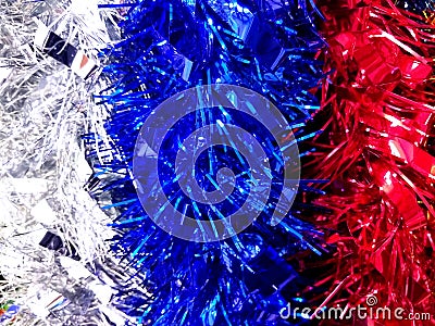 Red, blue and white new year tinsel decoration background Stock Photo