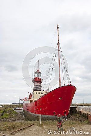 Red boat in marshes Stock Photo