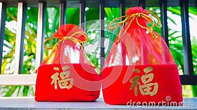 Red box gift box in Chinese New Year. Chinese character is `fu` means Luck and good fortune. Chinese New Year, elders always hav Stock Photo