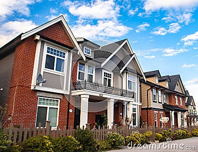 Red brick homes side by side. Row of Typical English Terraced Houses, townhomes. Editorial Stock Photo