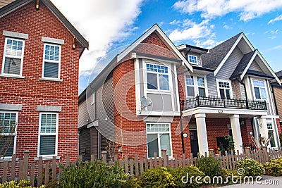 Red brick homes side by side. Row of Typical English Terraced Houses, townhomes. Editorial Stock Photo