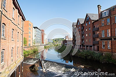 Red brick houses and River Don in Sheffield Editorial Stock Photo