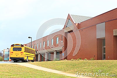 School Bus in front of Building Stock Photo