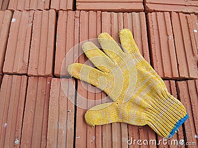 Red bricks and glove Stock Photo