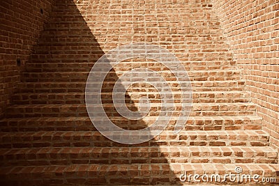 Red bricks made staircase with shadows Stock Photo
