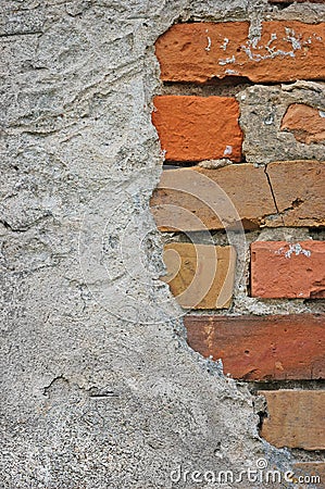 Red bricks stone wall background closeup, cracked ruined stucco, vertical plastered grunge grey beige stonewall limestone pattern Stock Photo