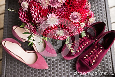 Red bridal bouquet from dahlias in focus. Wedding floristic Stock Photo