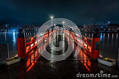 Red Bridge at night rain Stock Photo