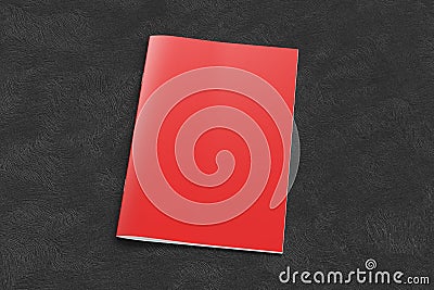 Red brochure or booklet cover mock up on black background. Isolated with clipping path around brochure. Side view. Stock Photo