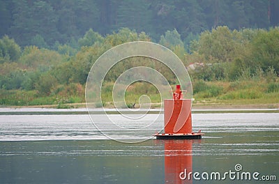 Red buoy - protects underwater obstacles and shows the border of the ship's passage from the right Bank Stock Photo