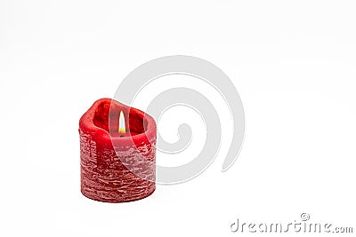 A red burning candle isolated on white background as Christmas card Stock Photo