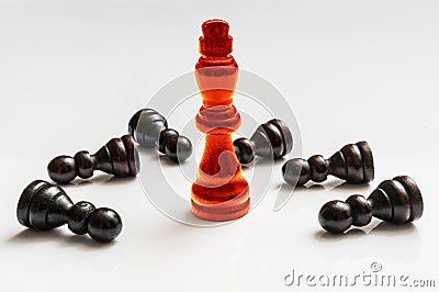 Red burning King and many fallen pawns - chess concept Stock Photo