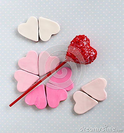 Red cakepop with hearts, blue background Stock Photo