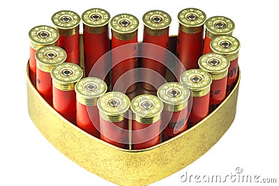 Red 12 caliber bullet shotgun shells in tin heart shape box. Gift for real man. Stock Photo