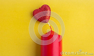 Red candle red hearts symbol on yellow background Stock Photo