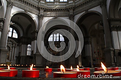 Red candles and church interior,venice, italy Stock Photo