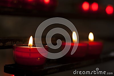 Red candles in a church Stock Photo