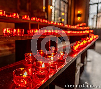 red candles in Frankfurt dom church, germany Stock Photo